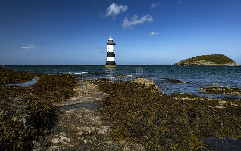 Penmon Lighthouse. Looking out at Penmon lighthouse along the Welsh coastline royalty free stock photo Penmon Lighthouse. Looking out at Penmon lighthouse along the Welsh coastline royalty free stock photo