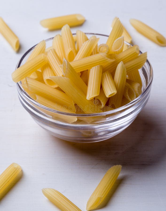 Penne in glass bowl stock photo. Image of pasta, food - 73459048