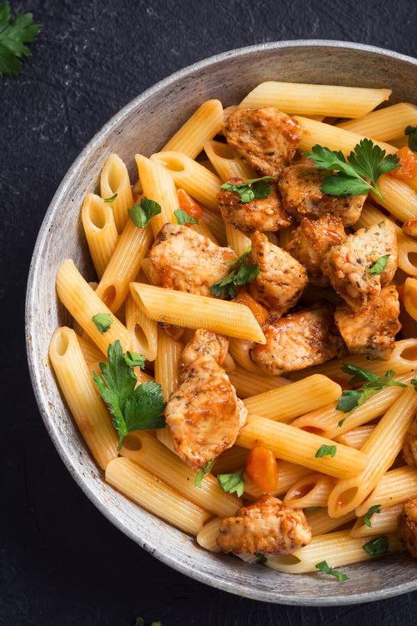 Penne pasta with chicken stock photo. Image of frying - 113532128