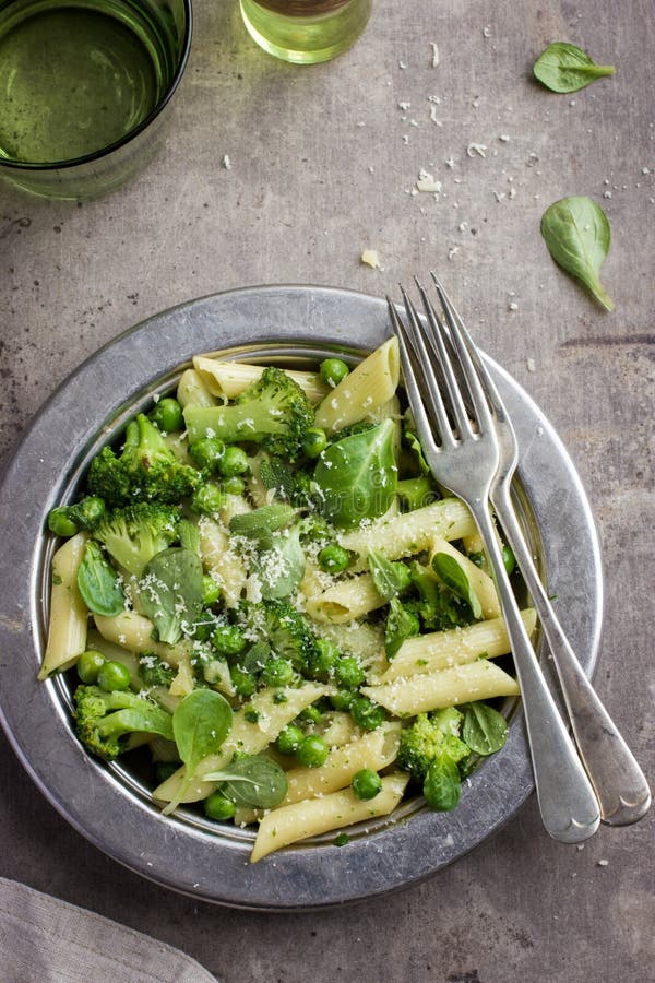 Penne Pasta with Spinach Pesto Sauce, Green Peas and Broccoli Stock ...