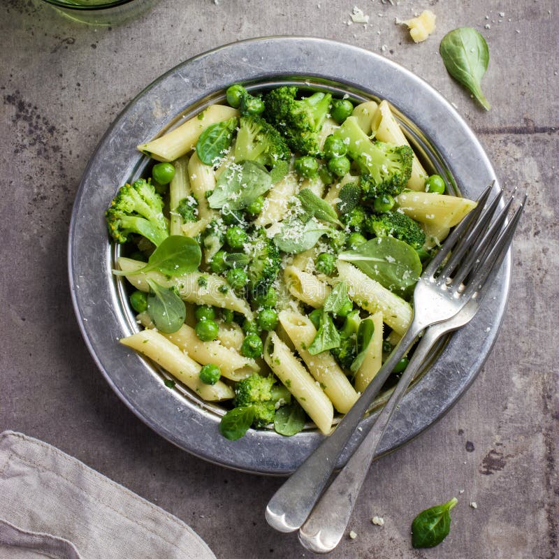 Penne Pasta with Spinach Pesto Sauce, Green Peas and Broccoli Stock ...