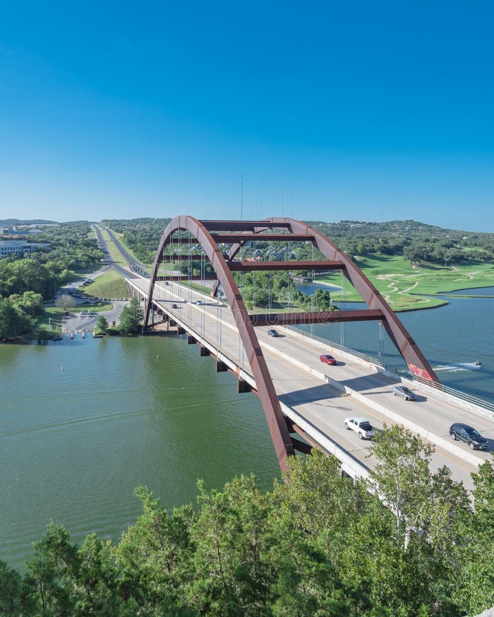 Pennybacker Bridge over Colorado river and Hill Country landscape in Austin