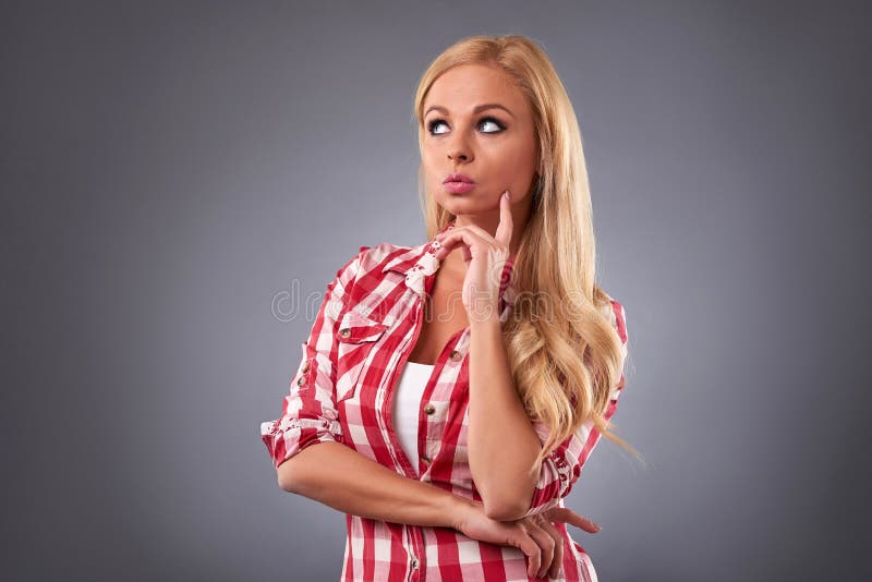 Pensamento da mulher nova foto de stock Pensamento da mulher nova foto de stock