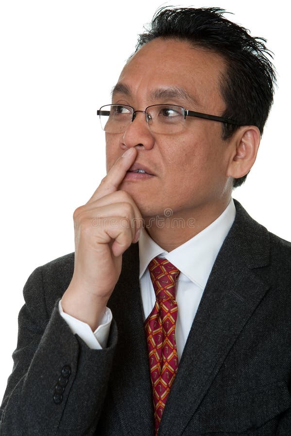 Pensamiento asiático del hombre de negocios del retrato imagen de archivo libre de regalías Pensamiento asiático del hombre de negocios del retrato imagen de archivo libre de regalías
