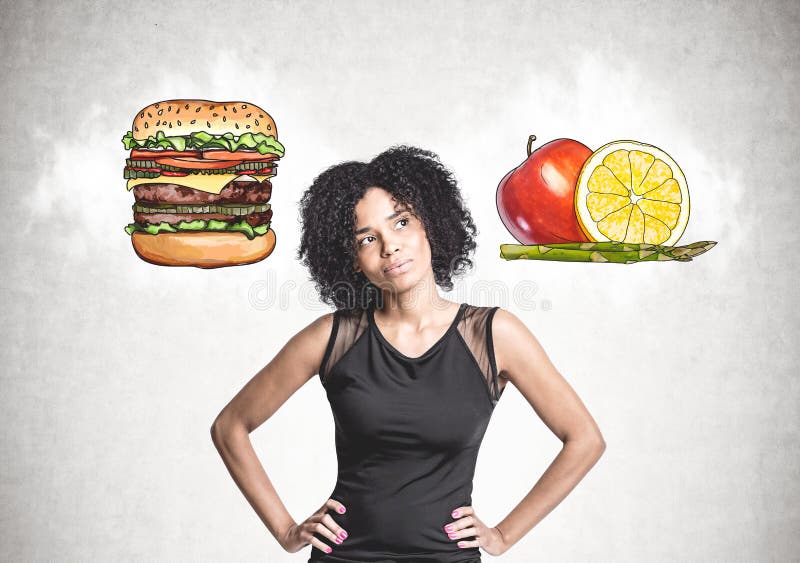 Pensive African American woman, food choice stock photos Pensive African American woman, food choice stock photos