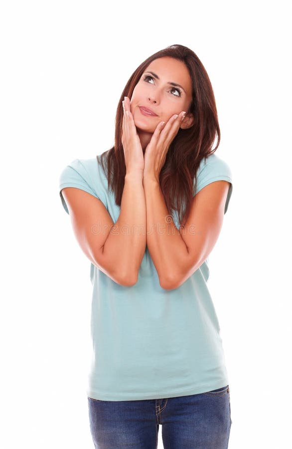 Pensive brunette with her hands on face