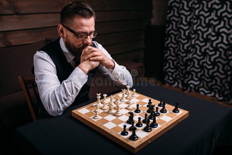 Focused woman thinking about next move and playing chess · Free Stock Photo