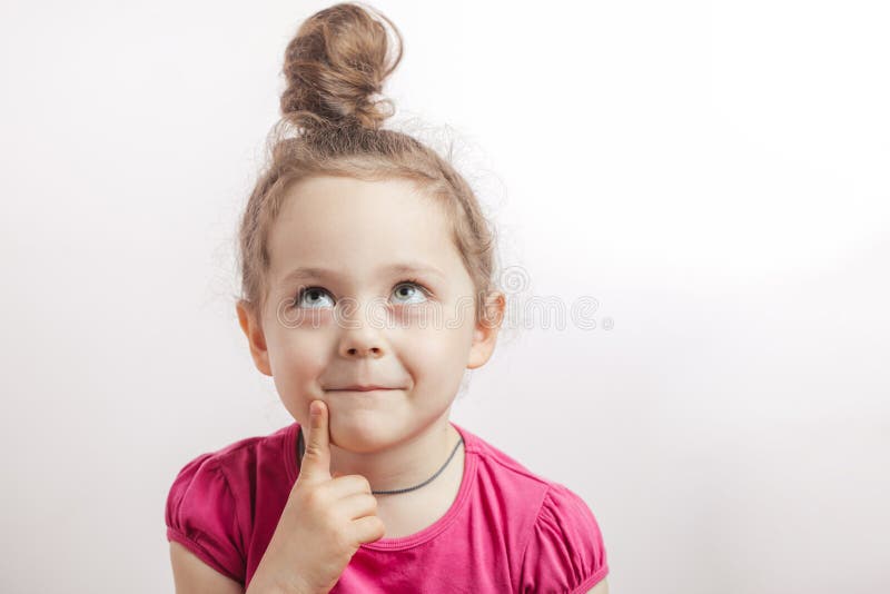 Pensive cunning girl looking up and thinking about something stock photography Pensive cunning girl looking up and thinking about something stock photography