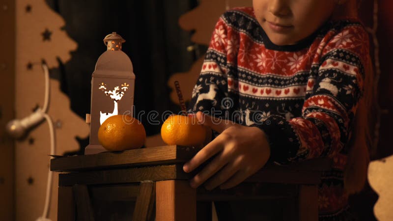 Pensive little girl writes a letter to Santa in slow motion