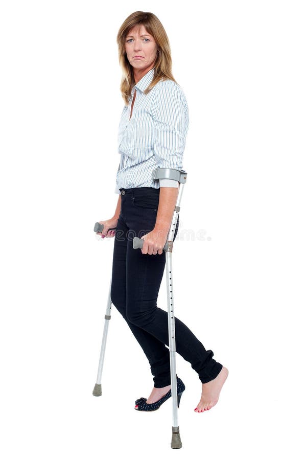 Pensive Looking Woman Using Crutches To Walk Stock Photo Image 29019996