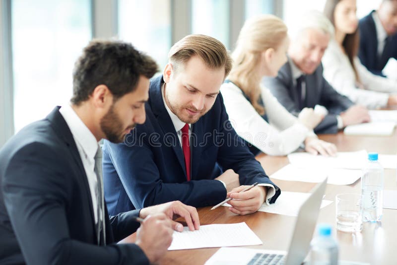 Discussing task at business class stock photo