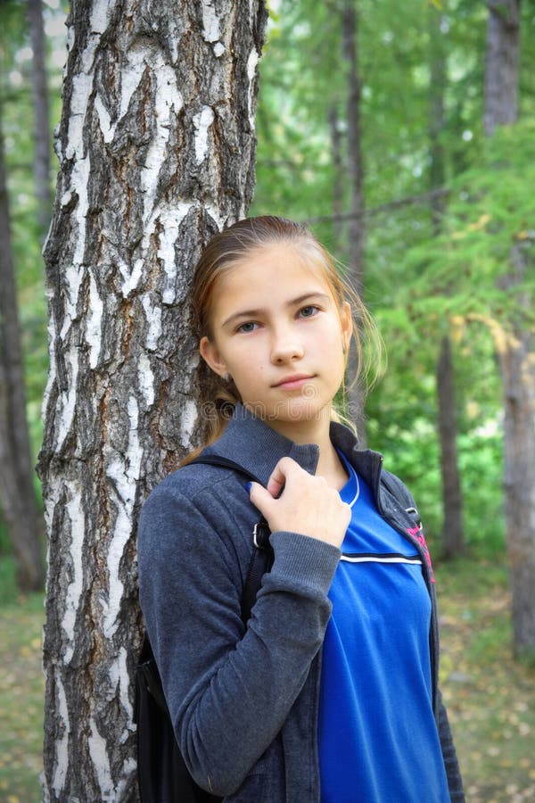 Teen girl sad looking into the camera