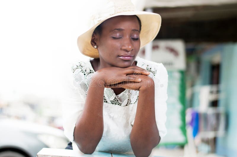 Pensive young woman in concentration.