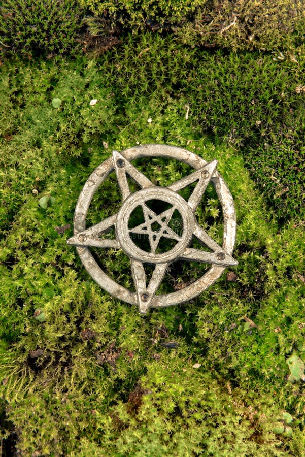 Old steel Pentagram closeup photo on background