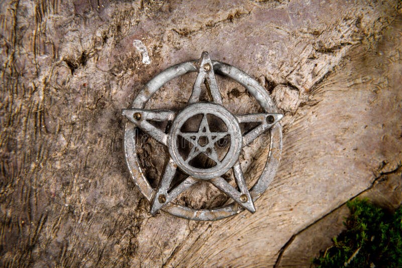 Old steel Pentagram closeup photo on background