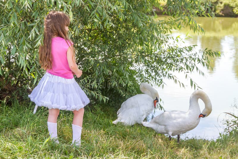 People and animals. Lovely charming kids playing having fun with stock photography People and animals. Lovely charming kids playing having fun with stock photography