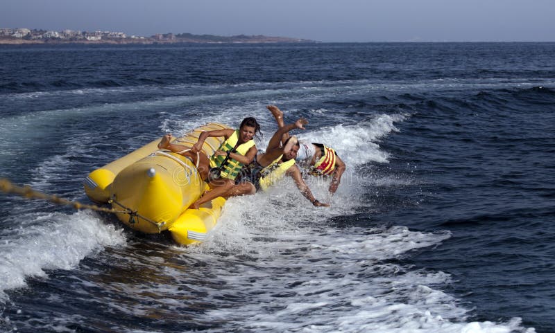 PEOPLE ON A BANANA BOAT