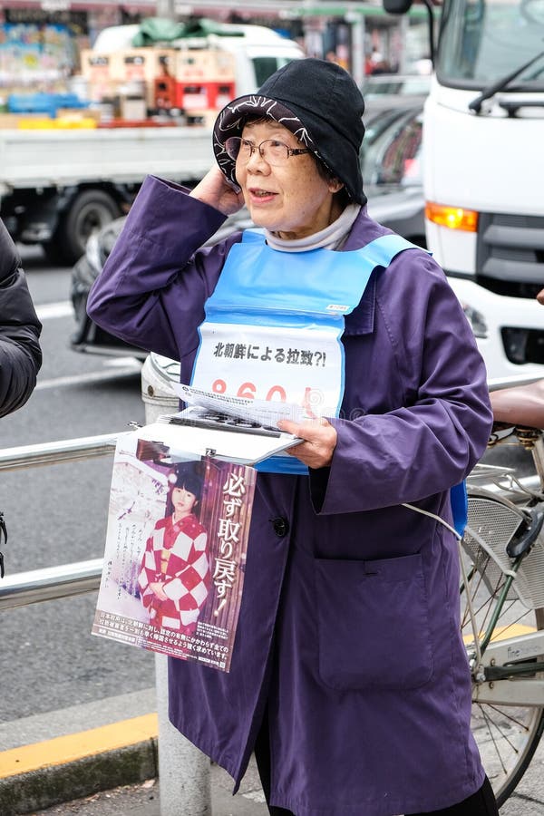 People call for immediate return of Japanese citizens abducted by North Korea. People demonstrate on the street near Ueno Park to call for immediate return of stock photo People call for immediate return of Japanese citizens abducted by North Korea. People demonstrate on the street near Ueno Park to call for immediate return of stock photo