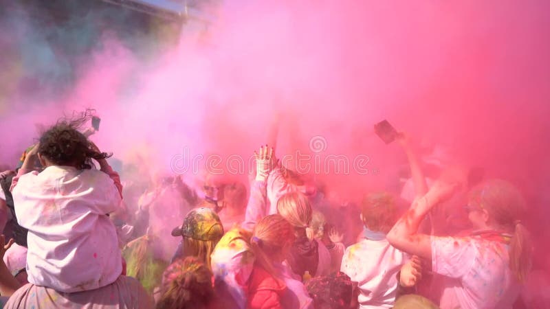 People celebrating holi festival with colors. Holi is a festival of India.