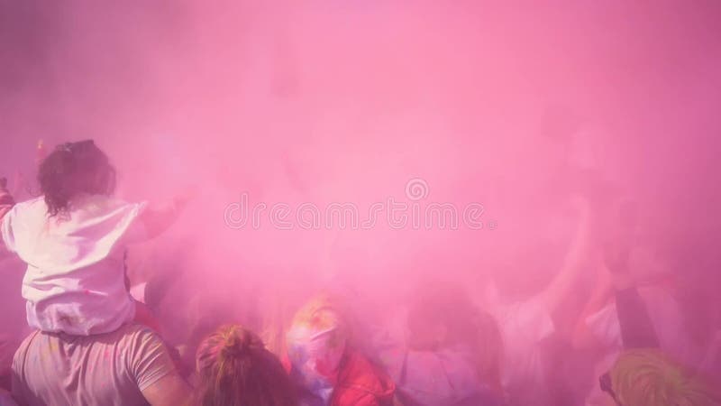 People celebrating holi festival with colors. Holi is a festival of India.