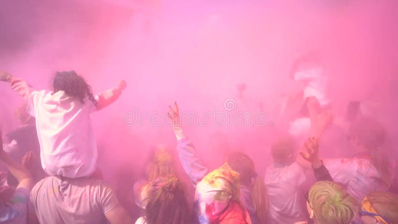 People celebrating holi festival with colors. Holi is a festival of India.