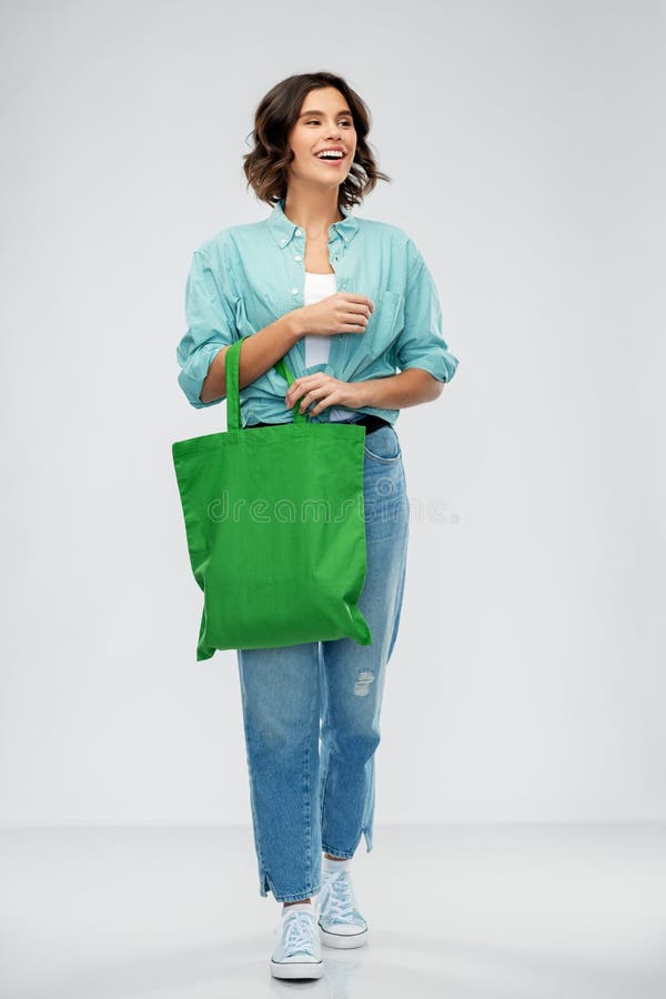 Woman with reusable canvas bag for food shopping