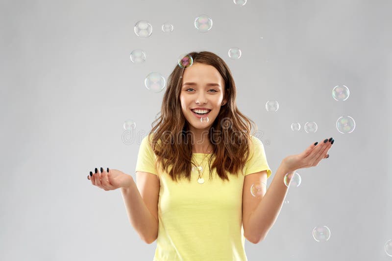 Young woman or teenage gir with soap bubbles royalty free stock photography
