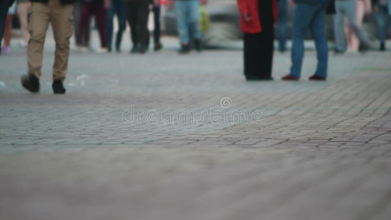 People crossing street time-lapse, close up of feet. people moving in crowded city street. Art toning abstract urban