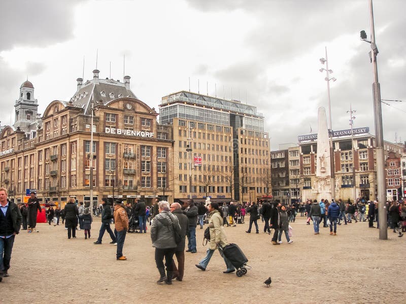 AMSTERDAM,THE NETHERLANDS - FEBRUARY 18, 2012 : People on the Dam Square in Amsterdam . Netherlands
