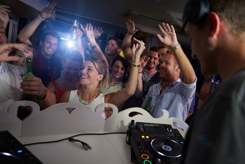 People Dancing in Nightclub with DJ in Foreground Stock Photo - Image ...