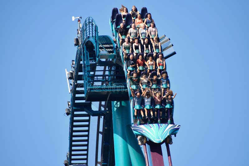 People of different ages thrilled and scared by fast descent riding Mako Roller Coaster at Seaw stock photo People of different ages thrilled and scared by fast descent riding Mako Roller Coaster at Seaw stock photo