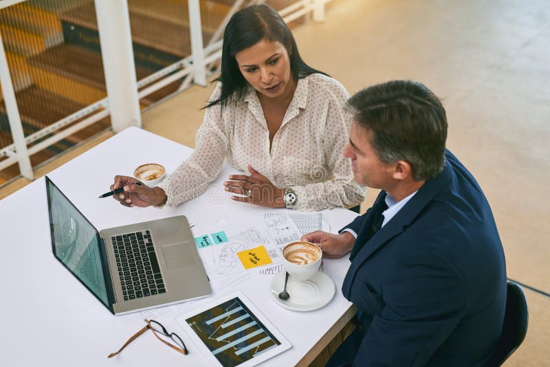 People, documents and business meeting with laptop at desk for financial report, budget or feedback. Top view, employees