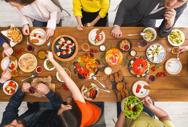 People Eat Healthy Meals at Served Table Dinner Party Stock Photo