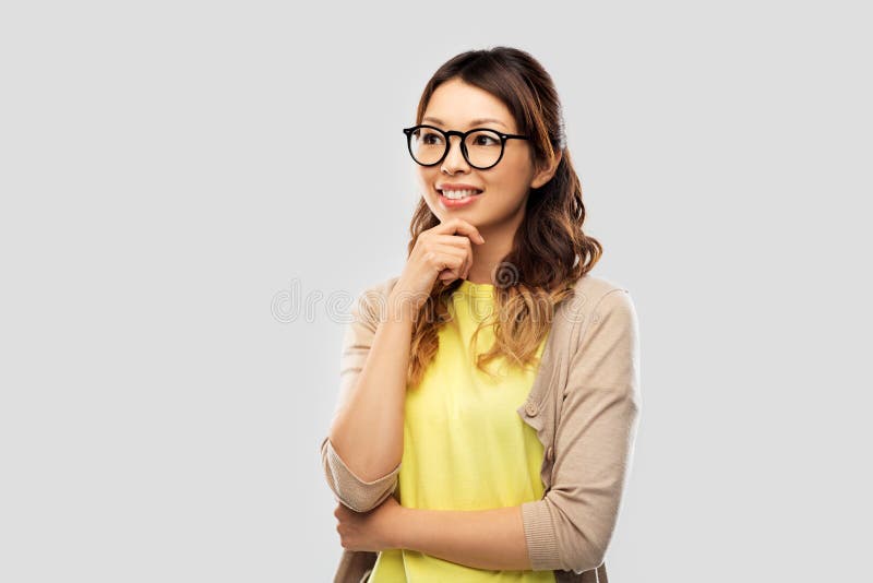 Happy asian woman in glasses or student