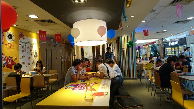 People enjoy delicious food at McDonald`s restaurant in shenzhen, China