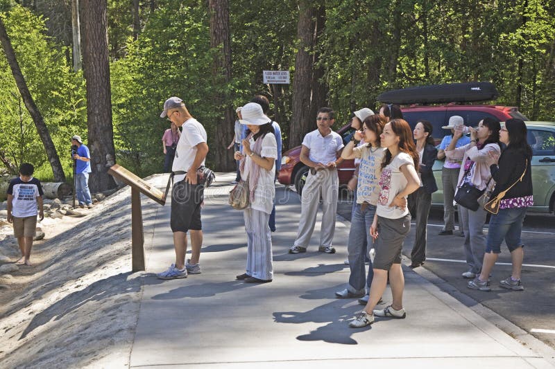 People enjoy the yosemite valley by a guided bus tour. Yosemite national Park, USA - July 22, 2008: people enjoy the yosemite valley by a guided bus tour