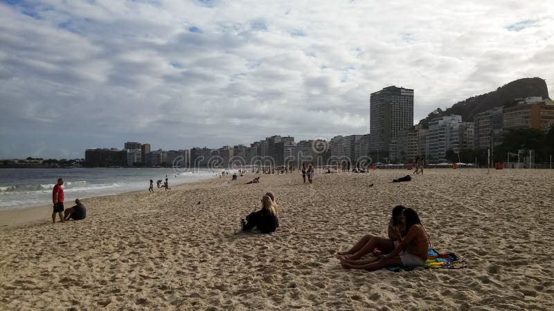 People enjoying the beautiful tourist beach of Copacabana in Rio de Janeiro stock photography People enjoying the beautiful tourist beach of Copacabana in Rio de Janeiro stock photography