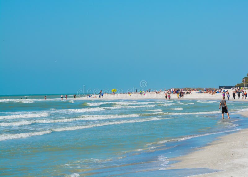 People enjoying the white sandy beach at Treasure Island Beach on the Gulf of Mexico, Florida