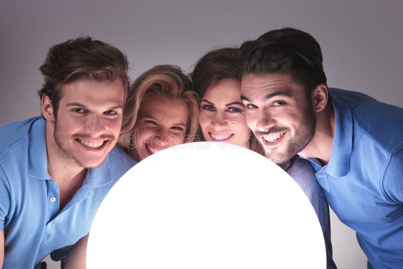 People with faces close to a big ball of light