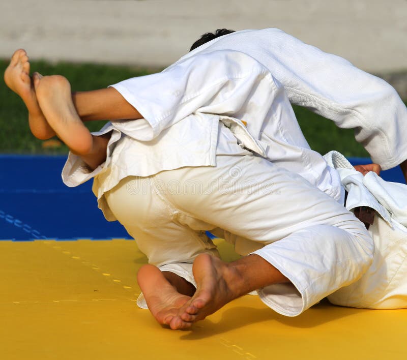 People fight with martial arts during the sporting event stock images