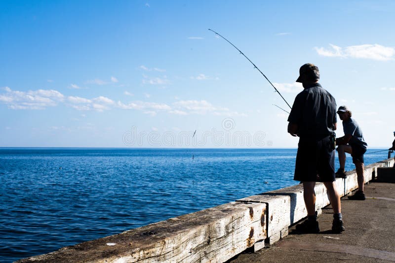 People are fishing Mackerel on the Gaspe Peninsula, Quebec.