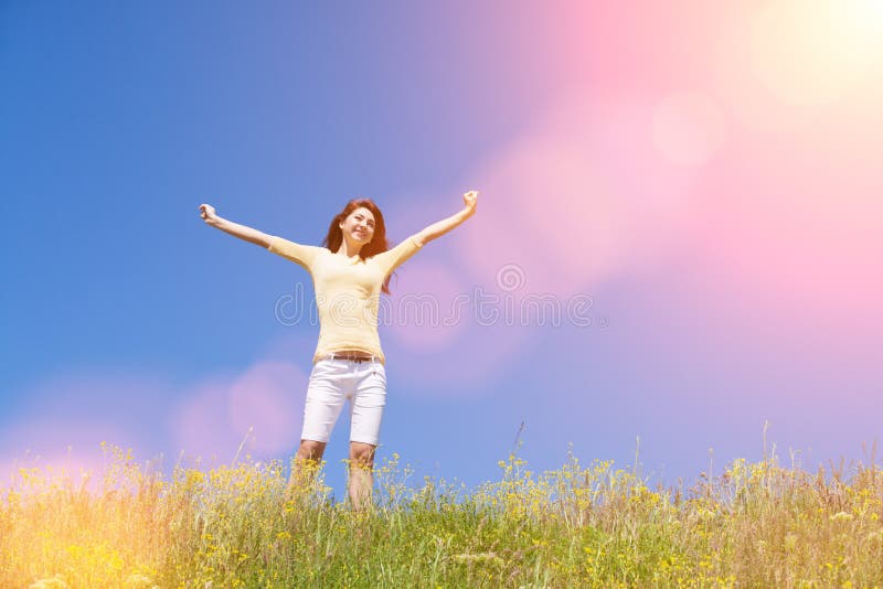 People freedom success concept. Happy woman dreams to fly on winds. Landscape of grass and flower summer field on sunny day.