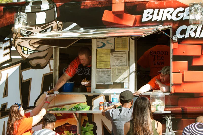 People Get Served at Atlanta Food Truck Festival Editorial Photo