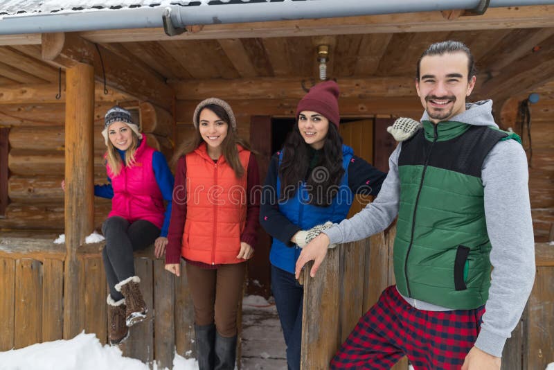 People Group Near Wooden Country Mountain House Winter Snow Resort Cottage