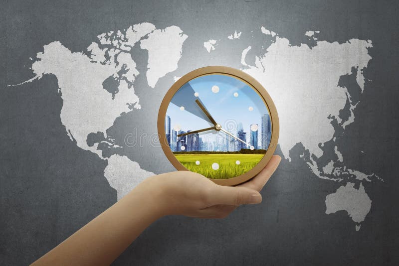 People hand holding clock with world map royalty free stock photography