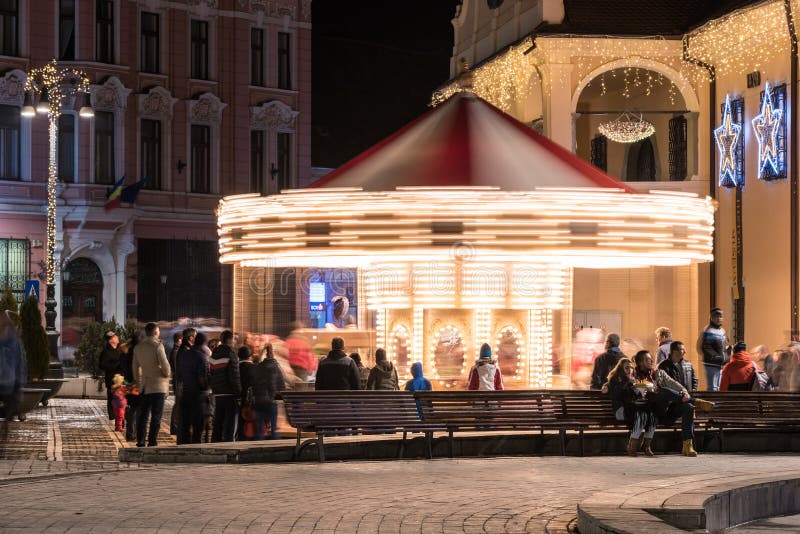 People Having Fun On Christmas Fairground Carousel stock image People Having Fun On Christmas Fairground Carousel stock image
