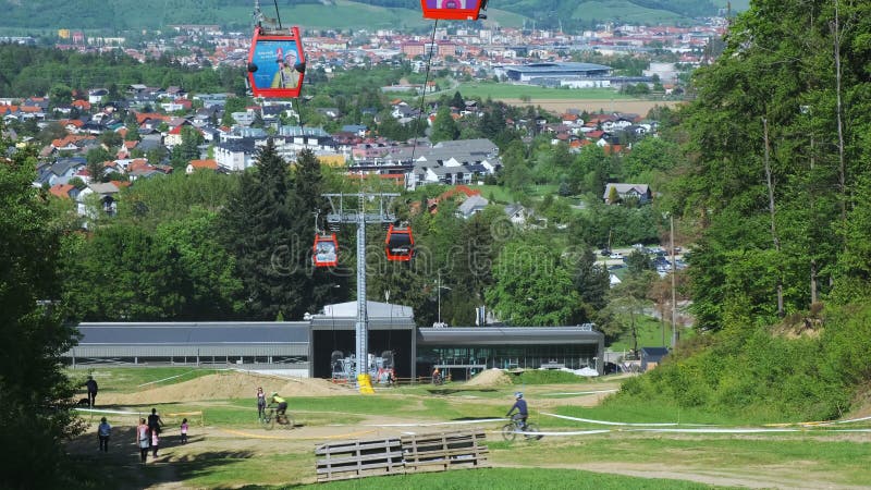 People hiking naer lower cable car station on Pohorje mountain in Maribor, Slovenia in summer