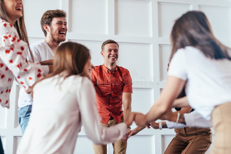 People hold hands, play and have fun. stock photography