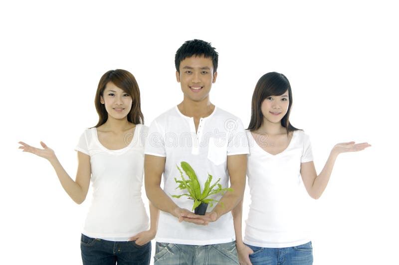 People on holding a small plant