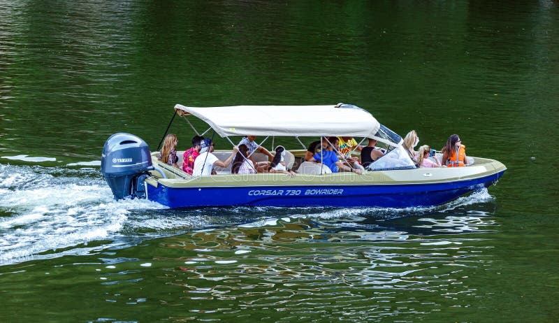 People in holiday cruising in a speedboat on Danube river stock photography People in holiday cruising in a speedboat on Danube river stock photography